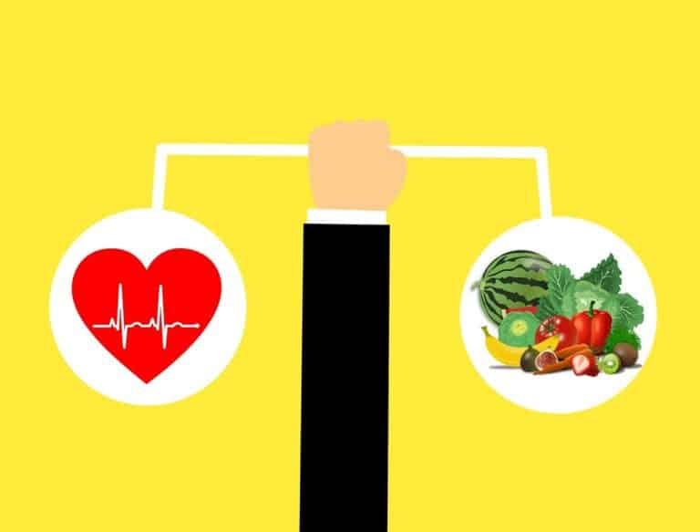 Illustration of a hand holding scales with a heart symbol on one side and healthy fruits and vegetables on the other, symbolizing balance between diet and exercise.